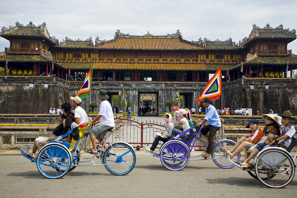 The best way to discover Hue city is by cyclo for a leisurely ride through its historic streets, ancient monuments, and peaceful riverside views